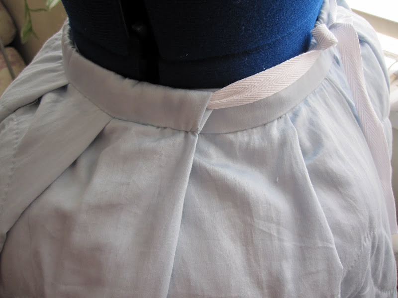Side of petticoat - you can see the front panel overlapping the back Side of petticoat - you can see the front panel overlapping the back