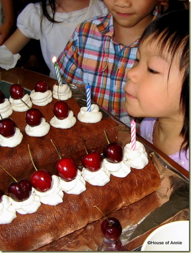 Esther blowing out 3rd birthday cake