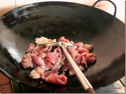 browning pork in wok