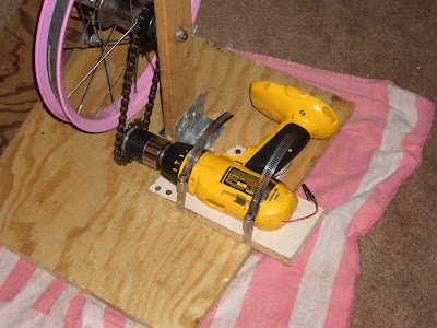 New setup with drill lying on it's side and securely attached to the base with hose clamps. No more flex!