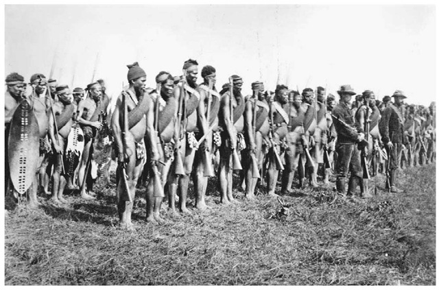 African Warriors in Natal, January 1, 1879. A contingent of African soldiers fighting for the British stand in formation behind British officers in the colony of Natal during the 1879 Zulu War. 