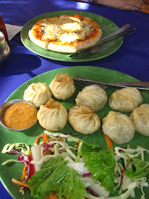 lunch of pizza and momos