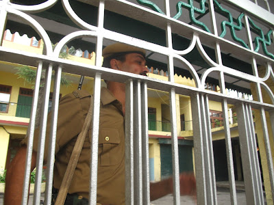 Security guard outside his office