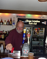 Fall Fleet Fling and skippers' meeting / Arvydas tending to the bar