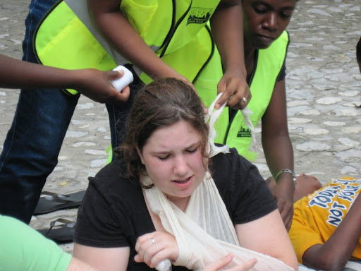Sister CERT members practice first aid on mission worker in Montrouis (pronounced Moe-wee) Haiti June 2010.