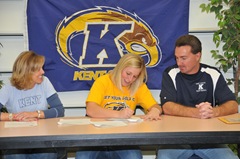 Abbey Ledford signs her letter of intent to Kent State as parents Lori and Gary look on from 11-16-09
