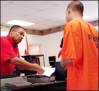 DHSMV staff Mr. Carl Harris verifies