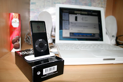iPod nano (black), white MacBook and JBL loudspeakers