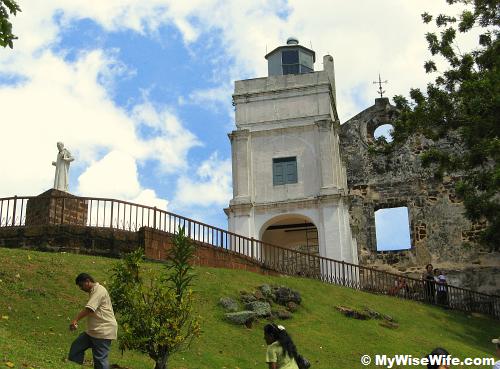 Statue, Light house and Church Statue, Light house and Church