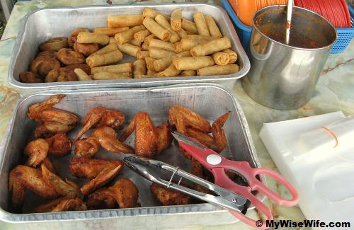 Deep fried spring roll, chicken wings and banana fritters Deep fried spring roll, chicken wings and banana fritters