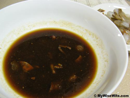 Tamarind pulps and seeds immersed in water Tamarind pulps and seeds immersed in water