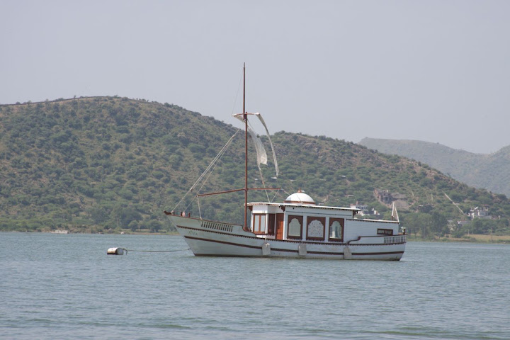A single luxury boat moored in the middle of the Pichola Lake in Udaipur - from the look, this seems like a boat meant for high end customers
