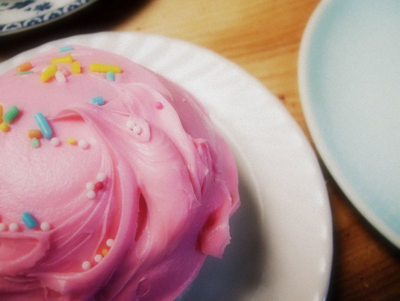 pink cupcake with sprinkles