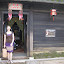 Gill outside Tan Ky House