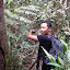 It's this way, honest. Pak Heri re-cutting the trail to the summit