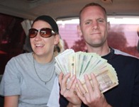 Shawn fanning a load of Ugandan money