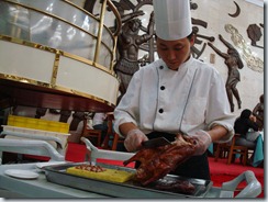 Chef preparing Peking duck.