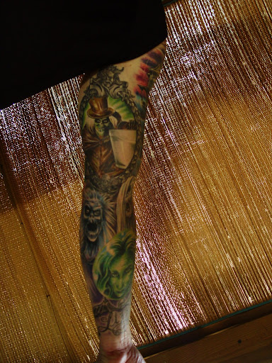 a tattoo with some Disney