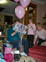 Lily and Taylor helped open the gifts.  Pahdurphy helped hold on to the balloons.