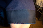 The ribbon reinforcing the hem