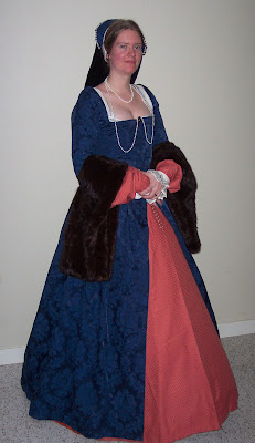 Gown, French hood, pearls and all