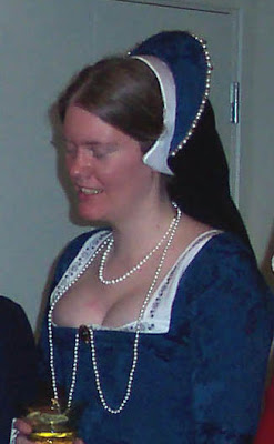 Closer view of hood, pearls and brooch