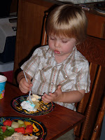 Liam eating Aunt Mary's 70th birthday cake at Cedar Lake.