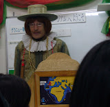Guy dressed up like English Explorer bringing over conpeito