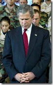 George W Bush praying