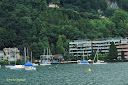 Sail boats, water, and hills at the shore of Lake Lucerne in Switzerland - looks like a great place to enjoy - Thumbnail
