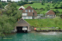 The private dock of a house with the raised motor boat on Lake Lucerne - Thumbnail