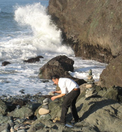 Man Stacking Rocks