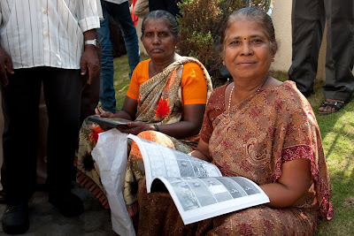 Two Deaf Indian ladies looking at the sign language storyboard book
