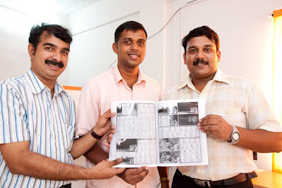 The artistic team hold their storyboard book