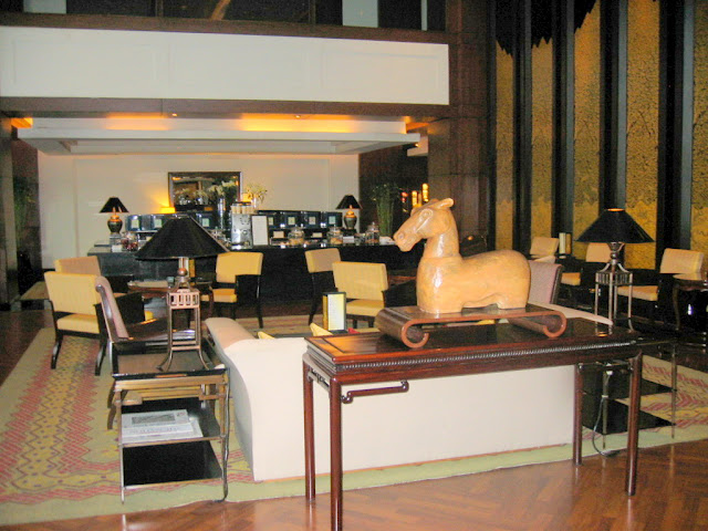 a room with a horse statue on a table