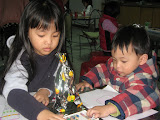 An adorable brother and sister at the coloring station