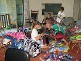 the kids are getting school supplies ready to deliver to kids in the disaster area