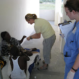 Robin translates medication instruction into Creole for Dr. Lauren.