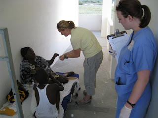 Robin translates medication instruction into Creole for Dr. Lauren.