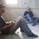 Mike, the cabinet maker, and Aria taking a well deserved break.  Too bad they're having to eat with plywood 'spoons'.