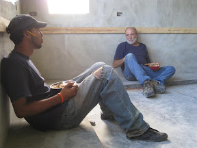 Mike, the cabinet maker, and Aria taking a well deserved break.  Too bad they're having to eat with plywood 'spoons'.