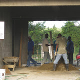 Mixing plaster on the floor by hand.