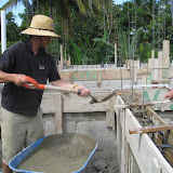 After four layers of block, concrete beams go around the walls.
