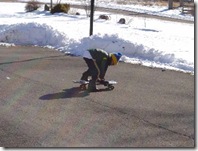 Cody playing on the skateboard