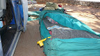 Blowing up the air matresses with a little pump. Our bed rolls