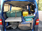 The car is packed and ready to drive up to Windhoek airport to pick up the clients and star the Safari. There is a fridge, the camping equipment, alarge table and the bedrolls on top.
