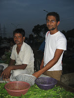 Picking up some vegetables at the local bazaar, Delhi