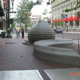 Artist created carved stone fountain and bench. Note mechanical vault hatch in foreground.