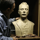 The artist working on the clay original