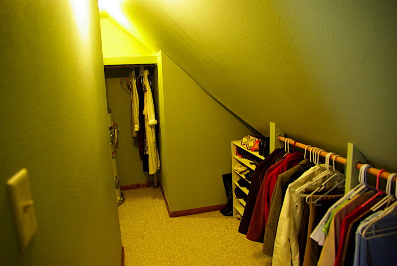 Because of the slanted ceilings, the hanging rack is low.  At the end of the closet on the left is a tall shelf for clothing and some drawers (you cant see it).  The closet is pretty spacious, though we may add some stuff to it to make it more functional.